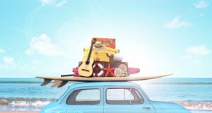 Car with luggage on the roof ready for summer vacation 3D Render